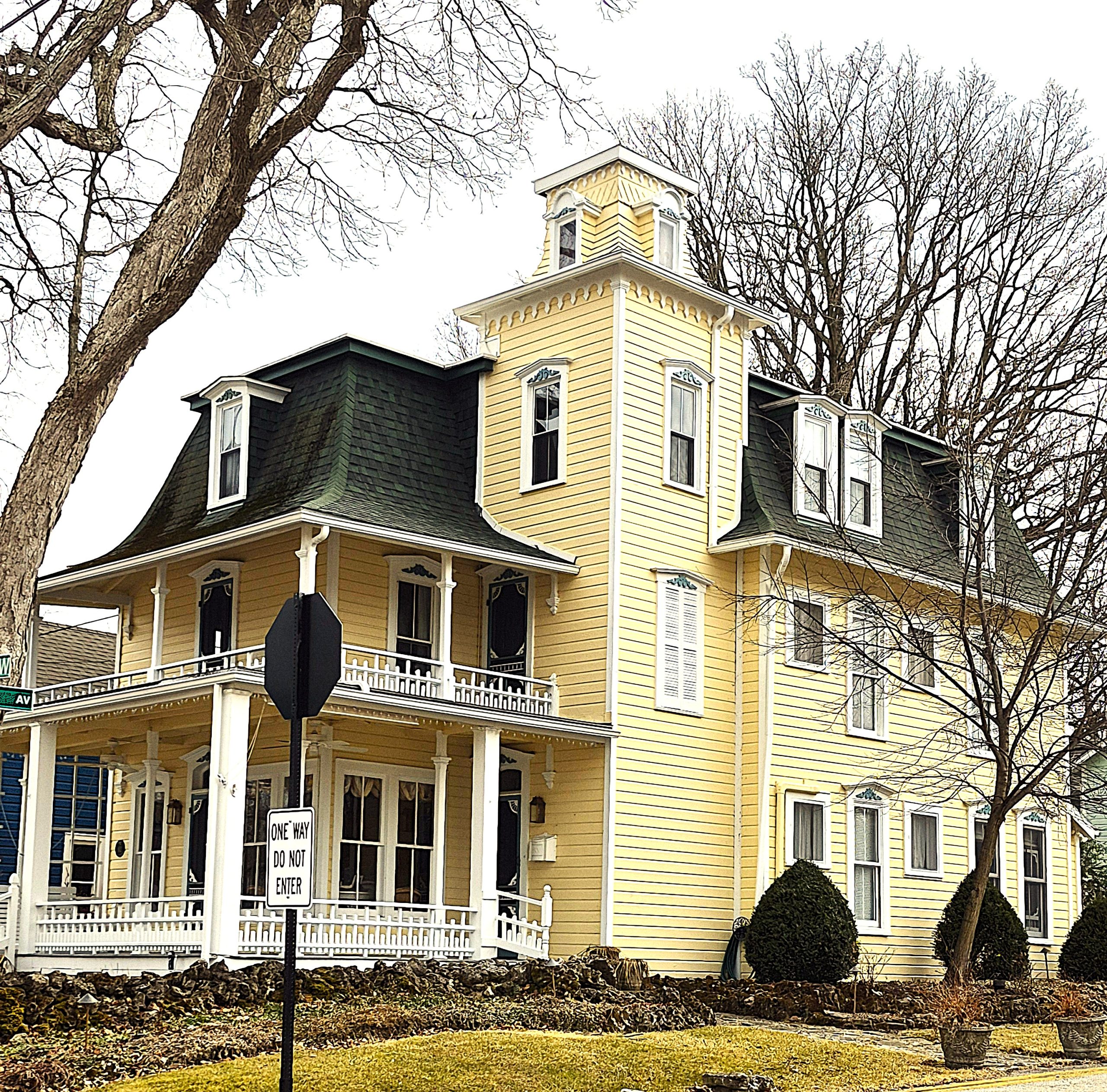 Freshly painted yellow home exterior by Hutchinson Painting